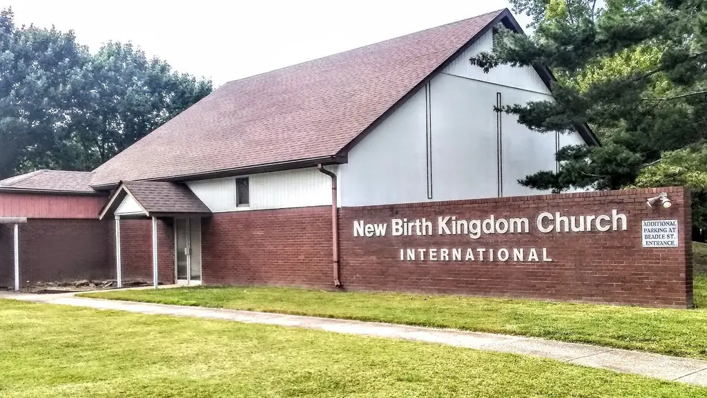 The covered porch and brick sign wall at the entrance of New Birth Kingdom Church International